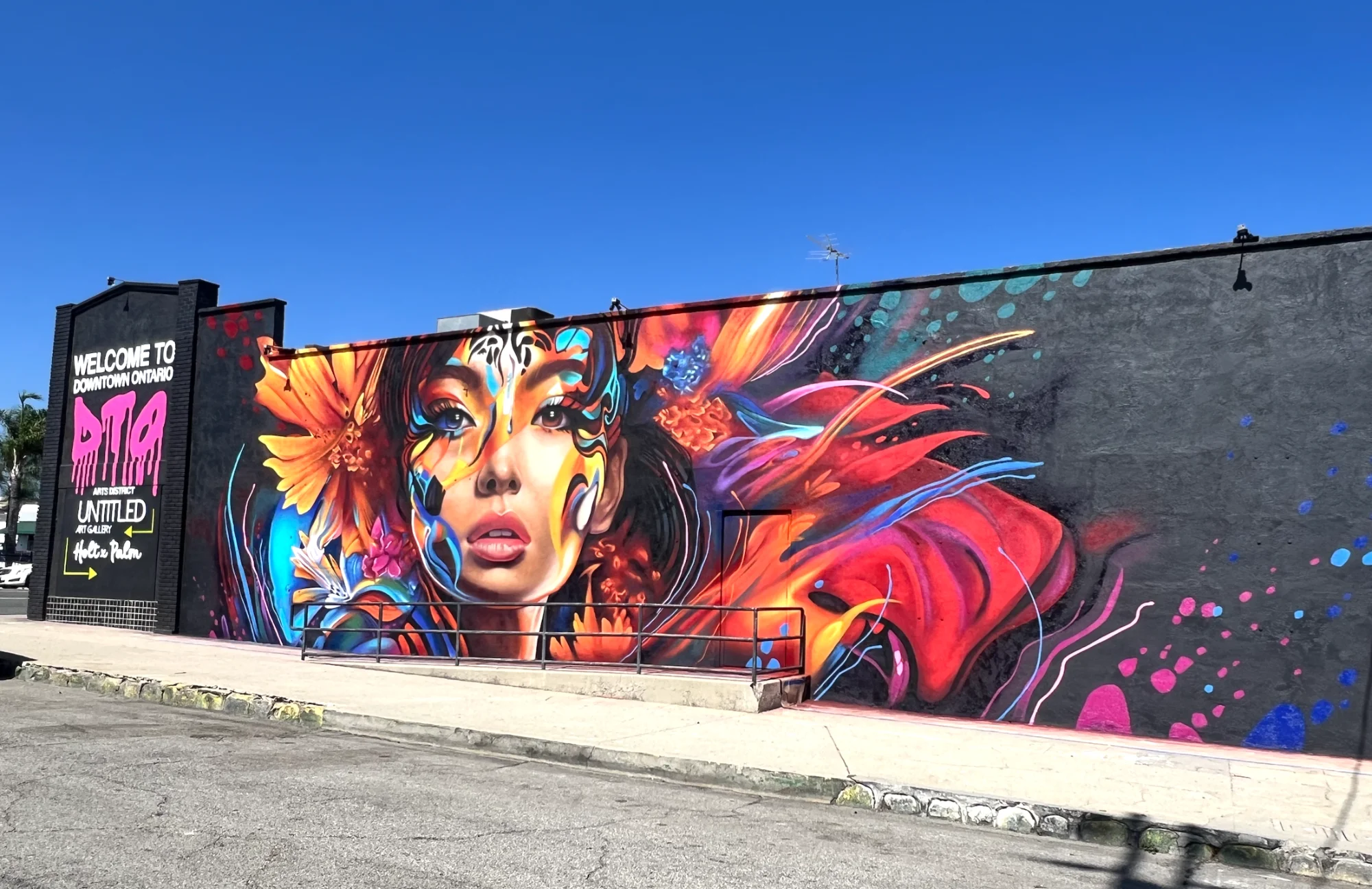Shane Grammer Mural - Woman with Sunflowers