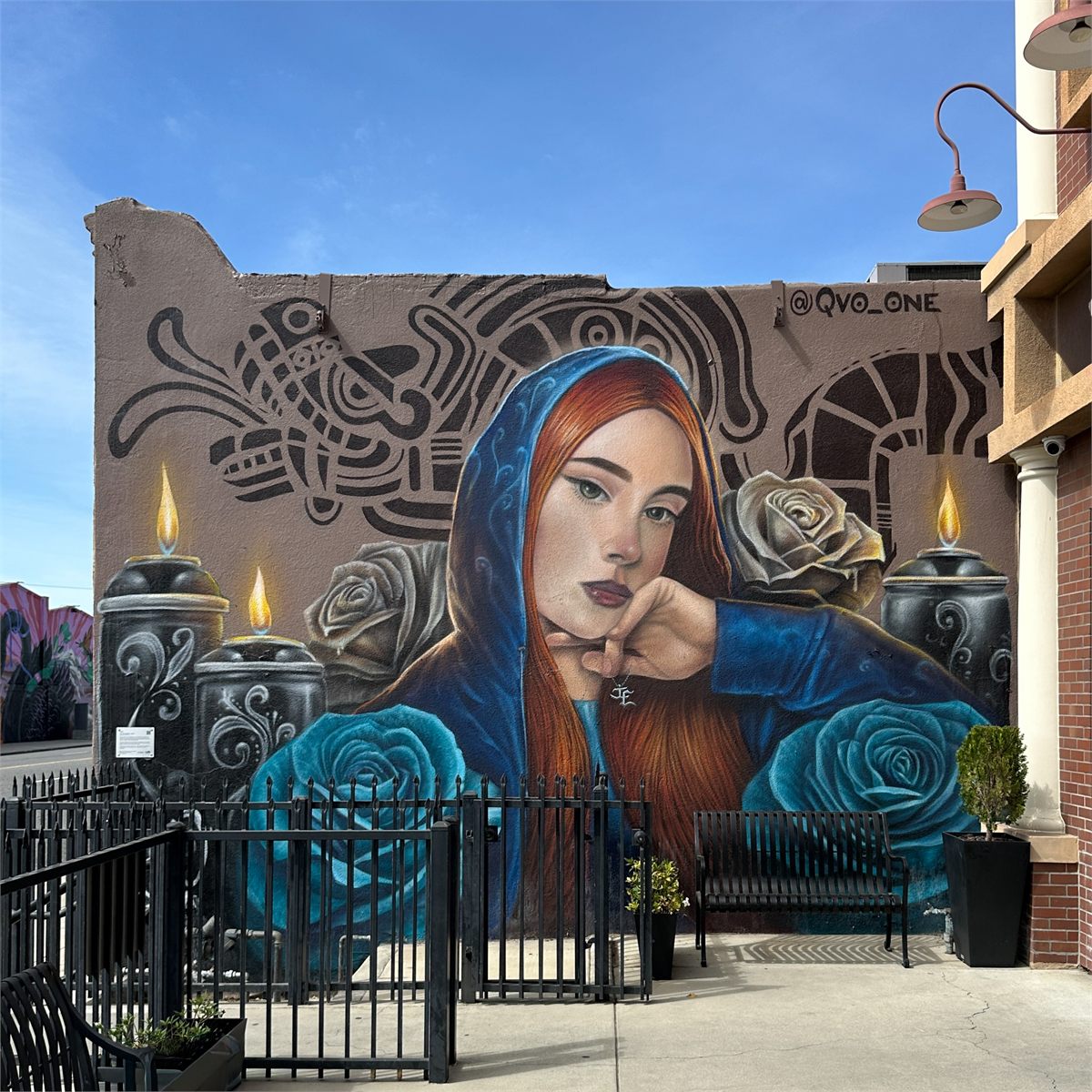 Completed portrait and blue rose mural in Downtown Ontario