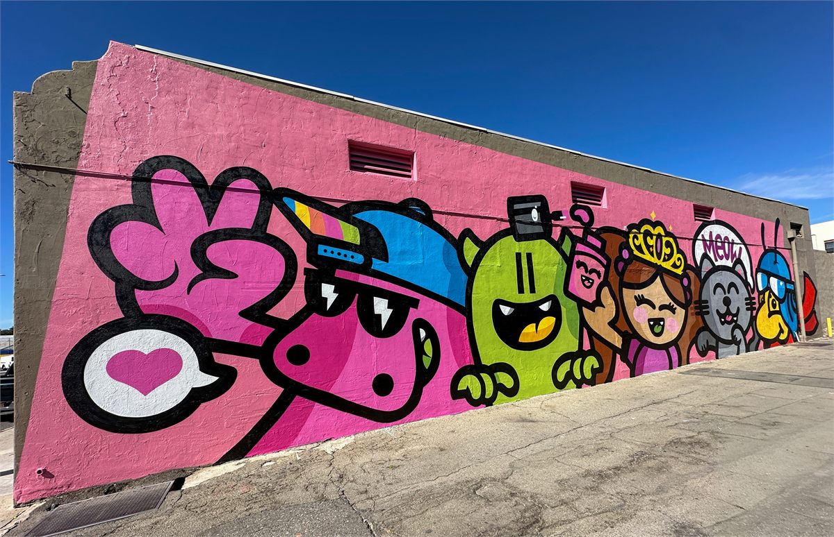 Completed colorful character mural in Downtown Ontario