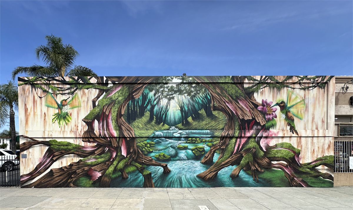 Completed forest and hummingbird mural in Downtown Ontario
